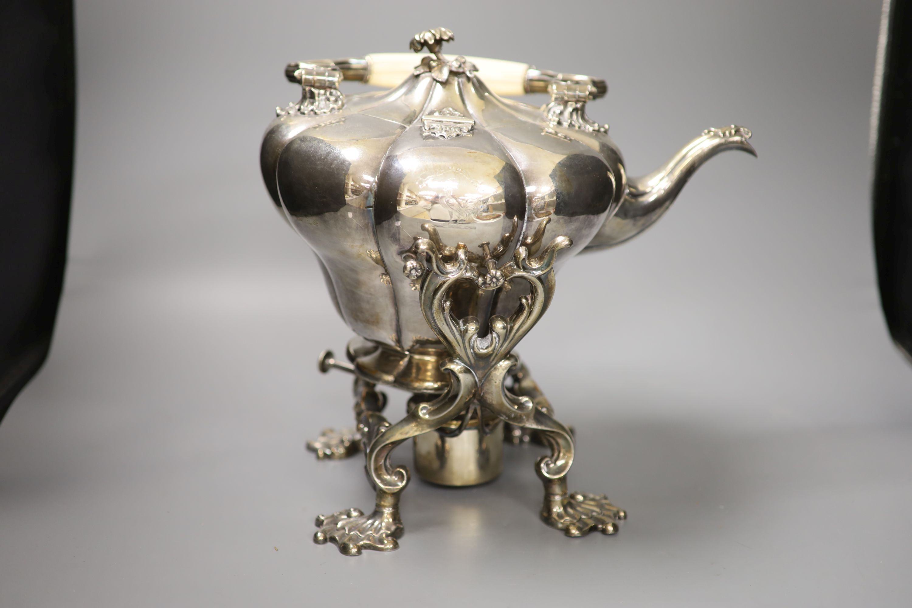 A mid 19th century silver plated tea kettle on a burner stand, height with handle down 31cm